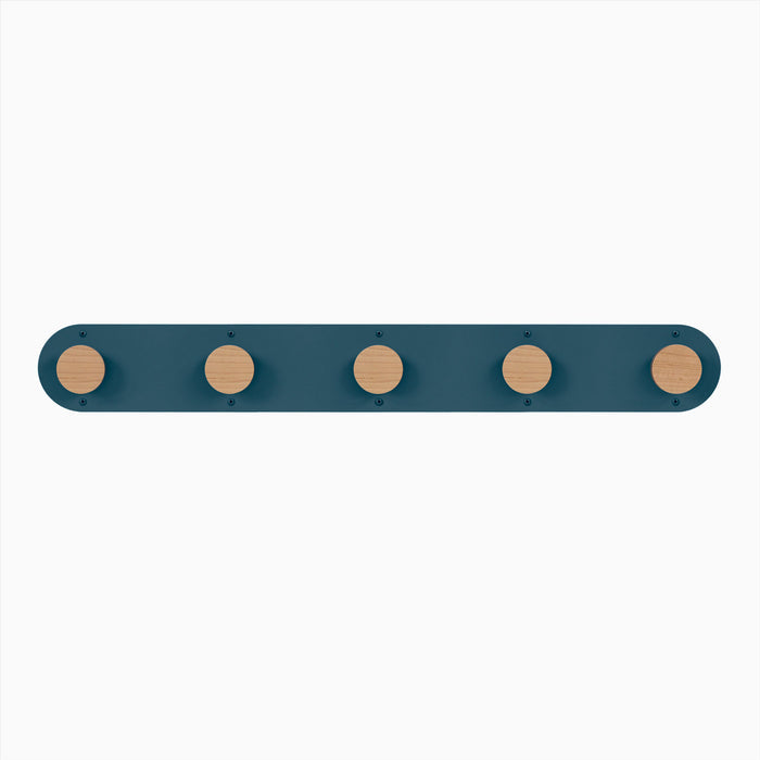 Runda Coat Rack 5 with five solid white oak pegs on a muted blue steel base for functional wall hooks and organization
