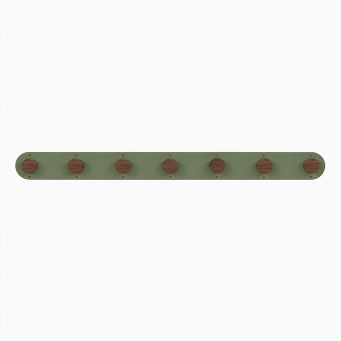 Runda Coat Rack 7 with seven walnut hardwood pegs on an olive green steel base for streamlined wall hooks and organization
