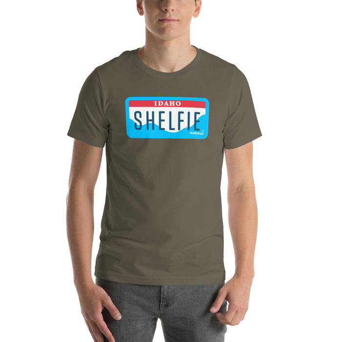 Shelfie T-shirt in muted olive green with bold Idaho license plate-inspired graphic, casual unisex fit by Shelfology