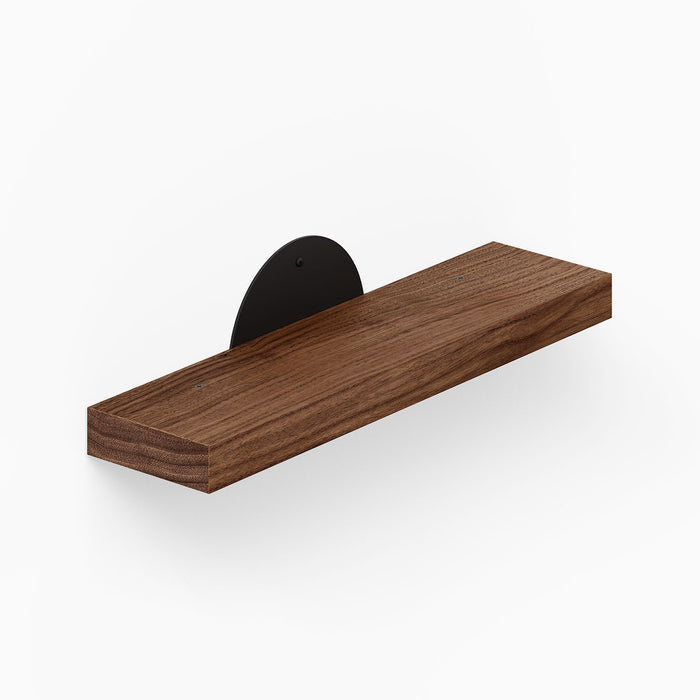Shortie Deux Wall Shelf features a minimalist walnut wood floating shelf with a sleek black metal bracket, ideal for stylish wall organization and display.
