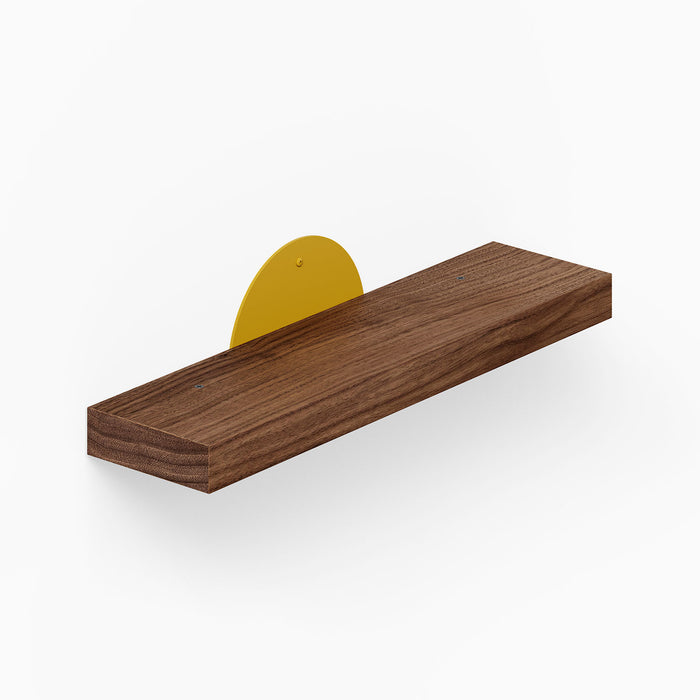 Shortie Deux Wall Shelf features a minimalist solid hardwood platform with a vibrant yellow steel bracket, blending wood and metal for stylish wall display.