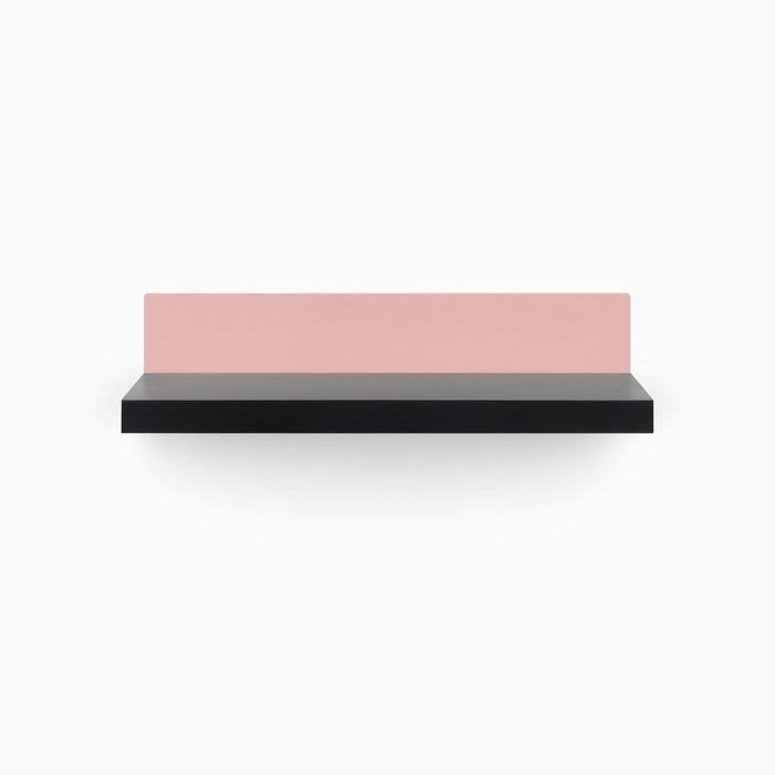 Skaksel Black Floating Shelf with sleek black ledge and contrasting muted pink steel back panel for modern wall organization