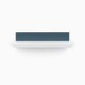 Skaksel White Floating Shelf with minimalist design featuring smooth white ledge and sleek blue metal back panel for modern display