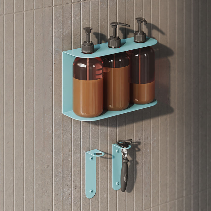 Soap Opera Shower Dispenser in a sleek blue metal wall mount holding three pump bottles with two matching blue wall hooks below, ideal for bathroom organization.