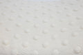 close up texture of cream pillowcase