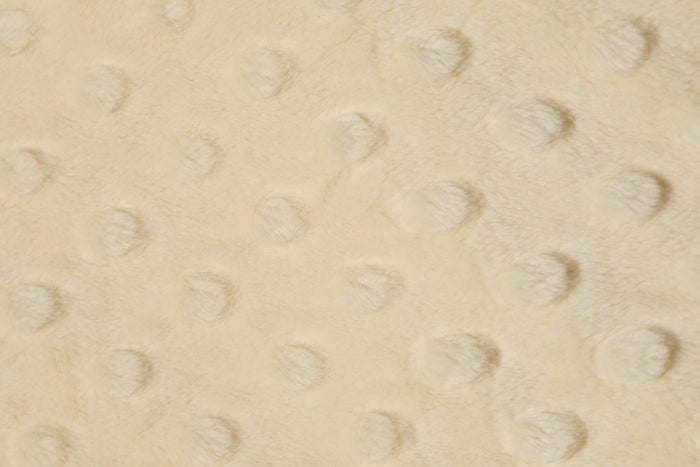 Close-up of a textured yellow fabric surface