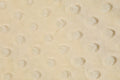 Close-up of a textured yellow fabric surface