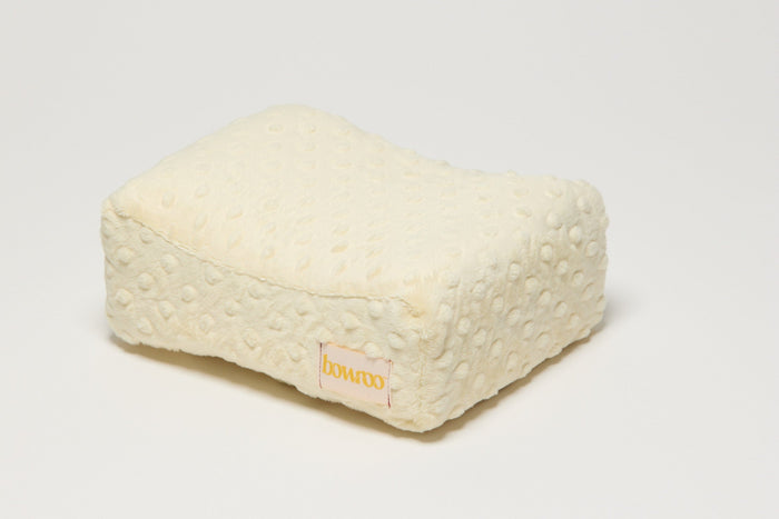 Yellow textured nursing pillow with a visible Bowroo brand logo on a light white background