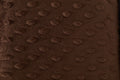 Close-up of a brown textured fabric surface