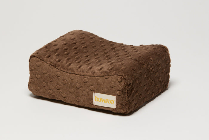 Brown textured nursing pillow with a visible Bowroo brand logo on a light white background