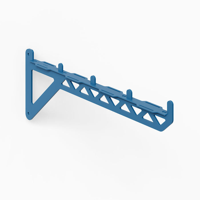 Studly Wall Storage System 2x6 Bracket in blue powder-coated steel, designed for durable, minimalist support of custom floating shelves and display ledges.
