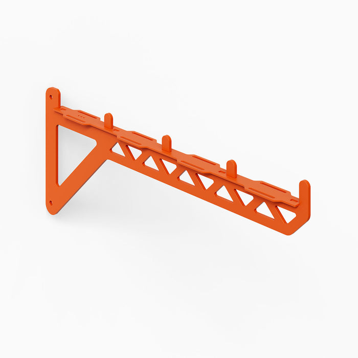 Studly Wall Storage System 2x6 Bracket in vibrant orange powder-coated steel, designed for versatile support of custom floating shelves, workbenches, and gear racks with minimalist style and durable strength.
