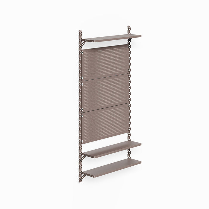 Studly Wall Storage System Pegboard Panel in rust-resistant dark bronze with integrated pegboard panels and three adjustable floating shelves for customizable wall storage and display.