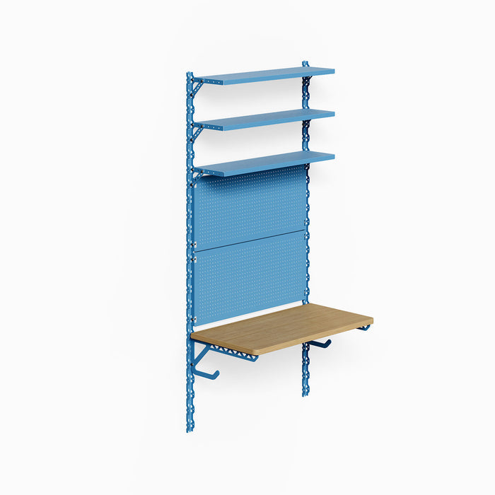 Studly Wall Storage System Steel Shelf in blue powder-coated steel with integrated honey mustard wood shelf, offering versatile wall organization, workspace, and durable display options.