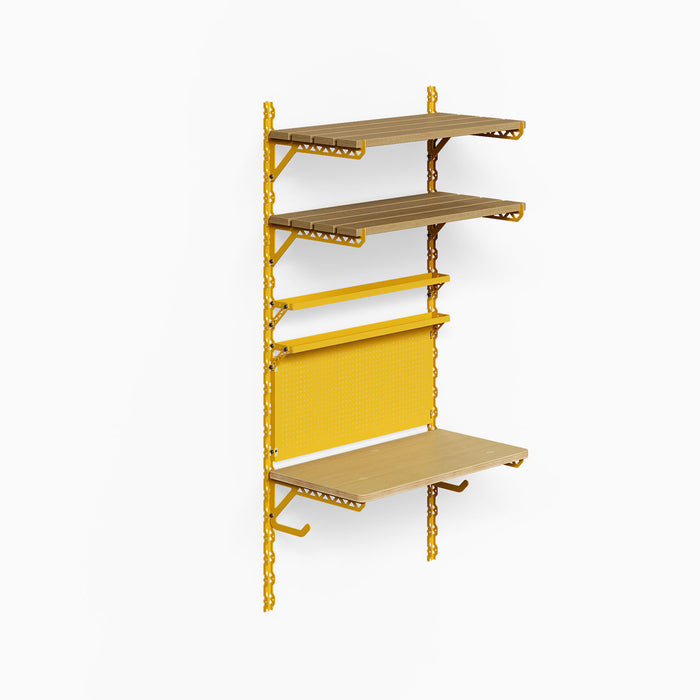 Studly Wall Storage Workbench & Tray system with solid wood shelves, metal brackets, hooks, and pegboard in a functional yellow steel frame for organized wall storage.