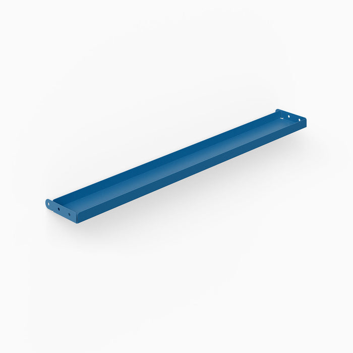 Minimalist blue steel wall-mounted tray designed for organizing and displaying items, part of the Studly Wall Storage System Steel Tray.