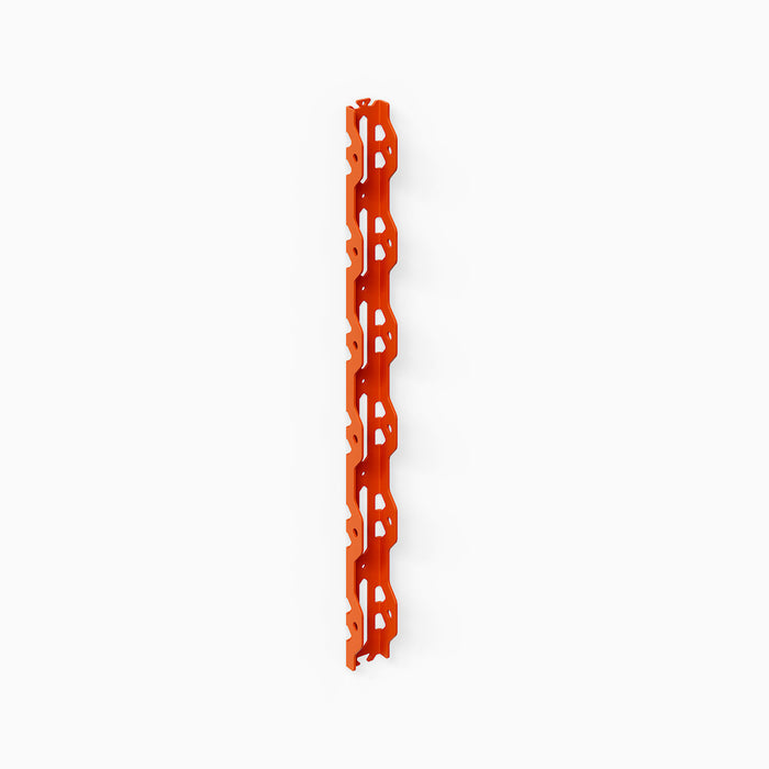 Studly Wall Storage System Vertical Rail in vibrant orange powder-coated steel, crafted as the sturdy foundation for customizable wall shelving and display by Shelfology, designed to organize and showcase with minimalist American craftsmanship.