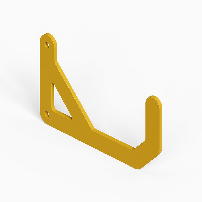 Yellow wall-mounted hook in minimalist design made of rust-resistant steel, part of the Studly Wall Storage System Ceiling Hook (Copy) for organized spaces.