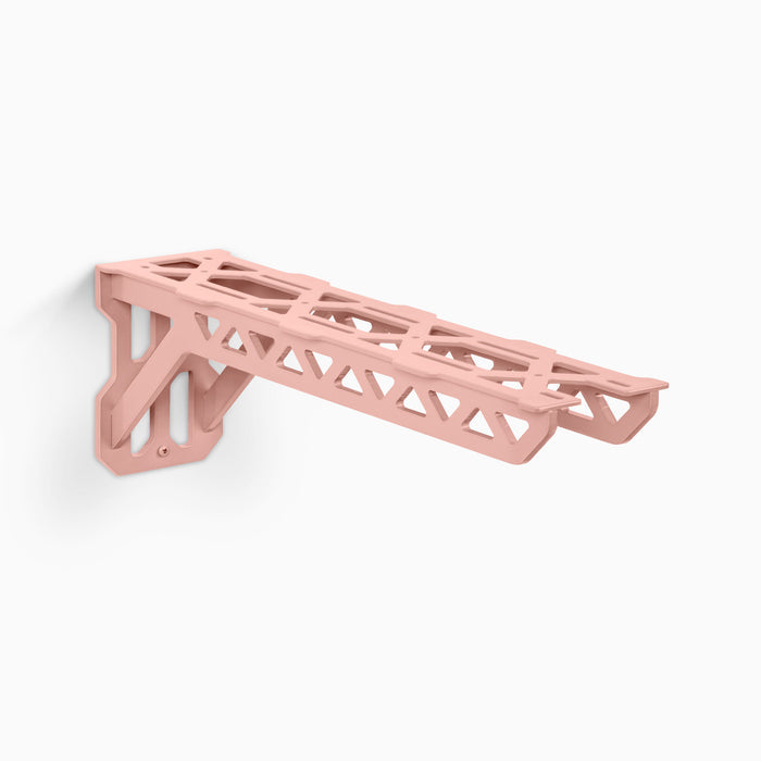 Studly Workbench Utility Bracket in pink steel with industrial design for strong, low-profile floating shelf support by Shelfology