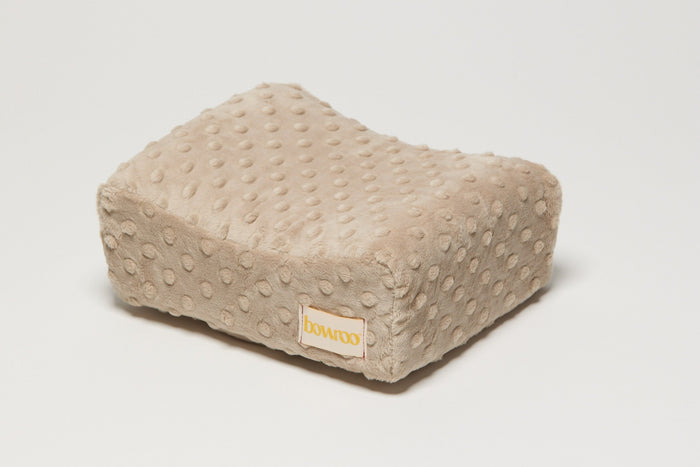Taupe textured nursing pillow with a visible Bowroo brand logo on a light white background