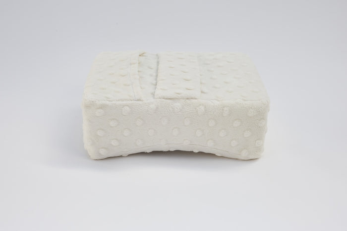 Close-up of Bowroo pillow's textured fabric and arm strap