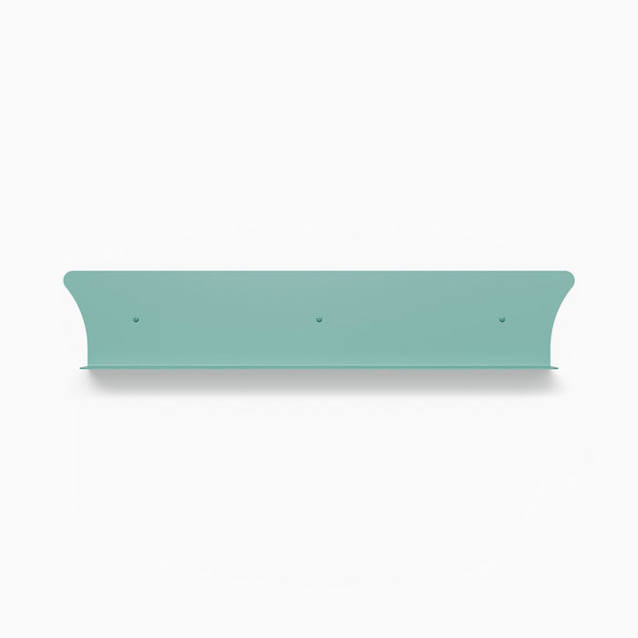 Tony Tony Tony Concave Shelf in soft aqua steel with curved back designed for minimalist wall display and storage solutions