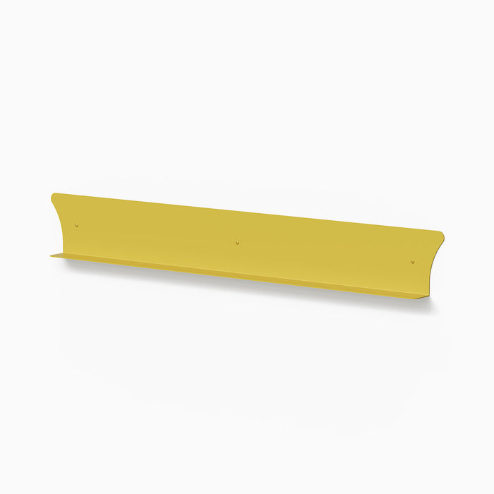 Tony Tony Tony Concave Shelf in mustard yellow steel with smooth curved back for minimalist wall display and organization