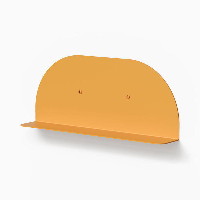Tony Tony Tony Convex Shelf in warm orange steel providing sleek, minimalist wall display and storage solution