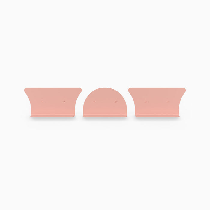 Tony Tony Tony Shelf Bundle showing pink convex and concave floating shelf brackets in minimalist design for wall display