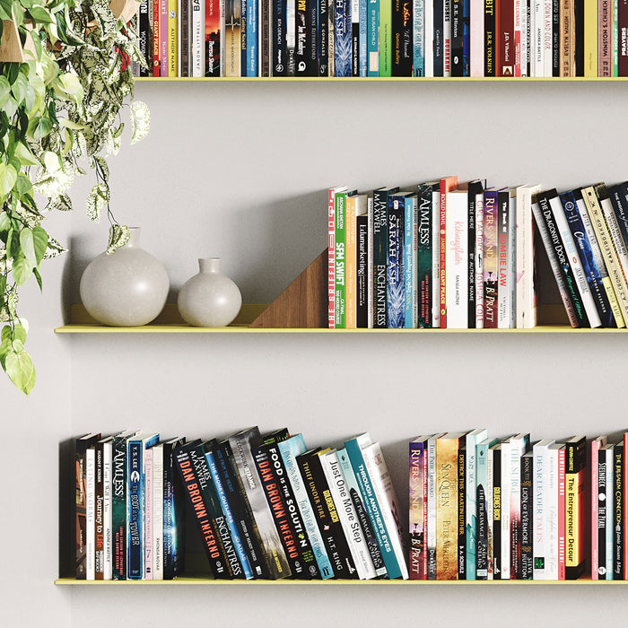 Tromso FM1 Steel Floating Shelf in yellow steel with books, wooden bookend, and ceramic vases in minimalist interior by Shelfology