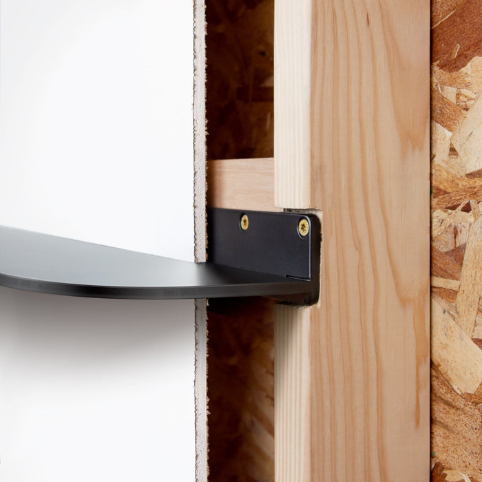Tromso RADius Steel Floating Shelf black steel bracket mounted on wood stud for durable wall display by Shelfology