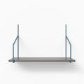 Verne Arsenic Tiered Shelf with a single dark wood ledge supported by muted blue metal floating shelf brackets