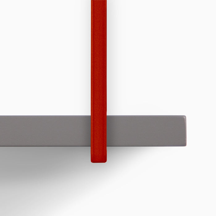 Verne Arsenic 5 Tiered Shelf detail of rust-colored metal bracket supporting muted gray wood floating shelf ledge
