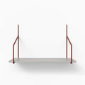 Verne Concretey Tiered Shelf featuring a concrete ledge with rust-colored metal floating shelf brackets in minimal design