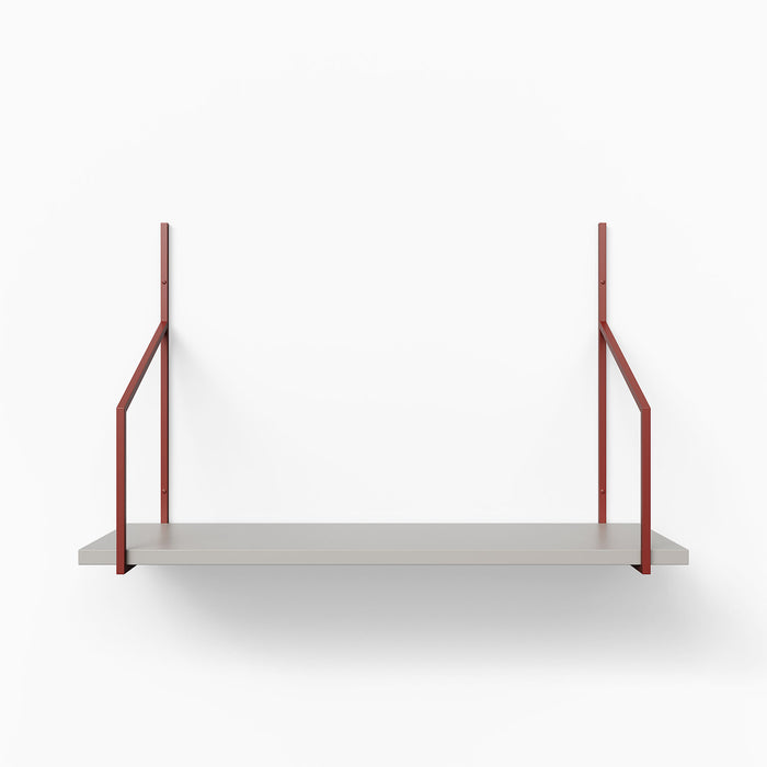 Verne Concretey Tiered Shelf featuring a concrete ledge with rust-colored metal floating shelf brackets in minimal design
