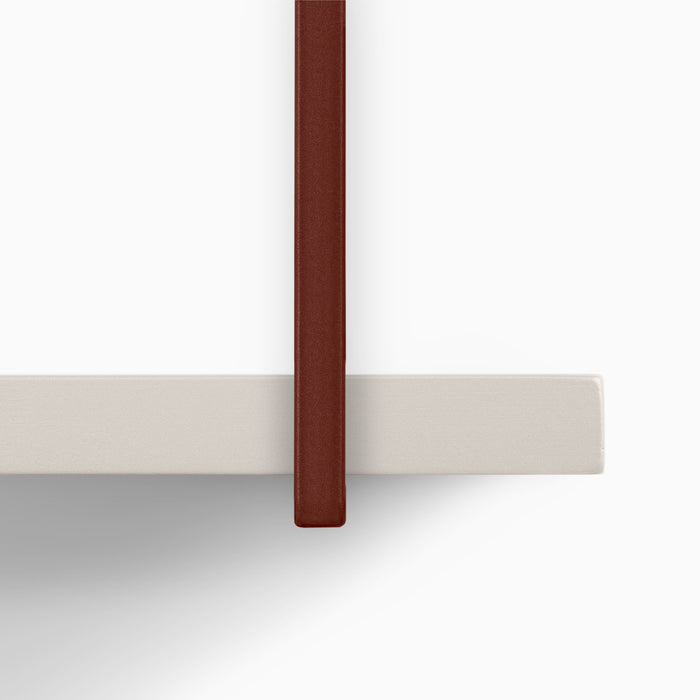 Verne Concretey 5 Tiered Shelf detail showing rust-colored metal floating shelf bracket with concrete ledge surface