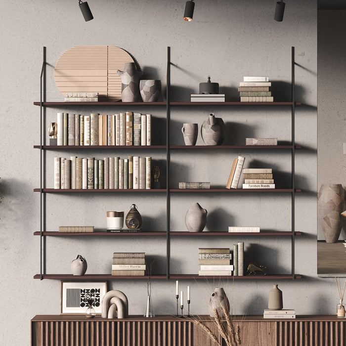 A modern tiered shelf system with dark brown wood and metal frames, filled with books, vases, and other decor items.
