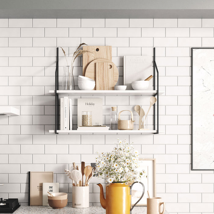 Verne White Tiered Shelf with clean white wood ledges and black metal floating shelf brackets in bright kitchen space