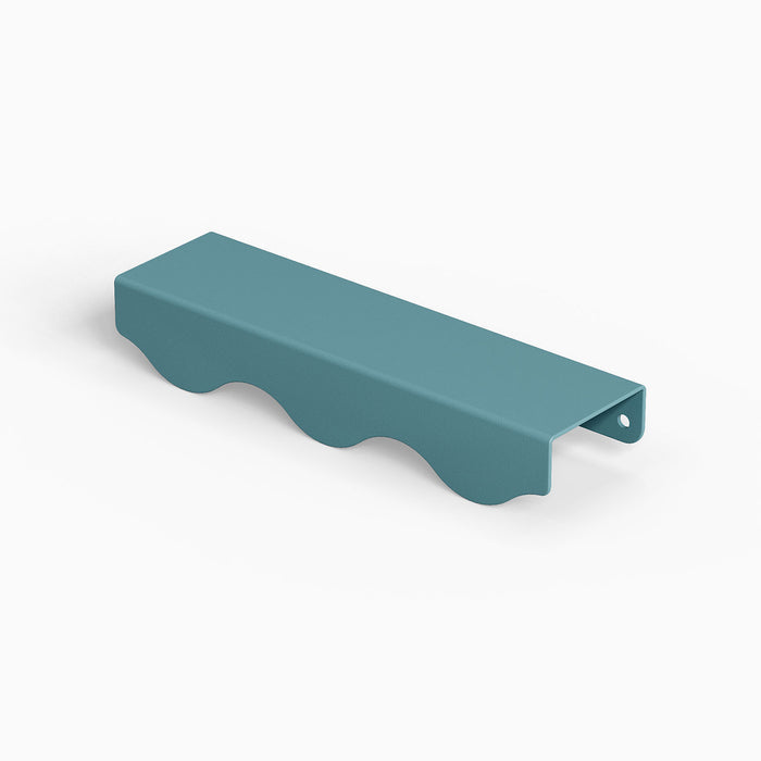 Wave Cabinet Pull in steely blue with smooth wave curves for durable, minimalist hardware enhancing floating shelf design