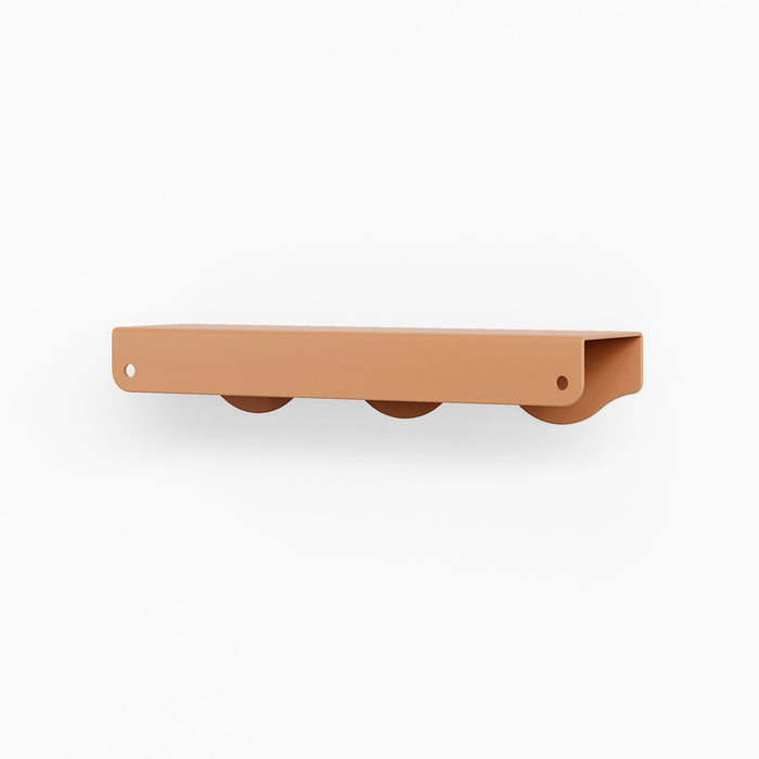 Wave Cabinet Pull in warm clay tone with smooth curved waves for durable, minimalist floating shelf hardware design