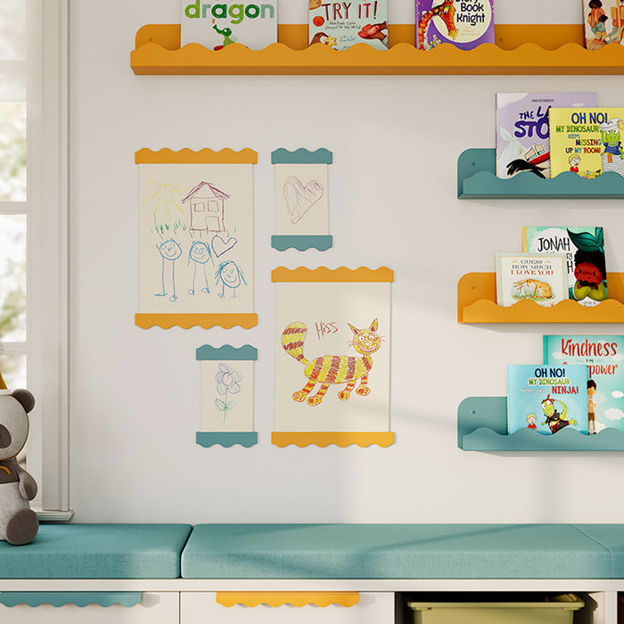 Wave Magnetic Print Hanging System in vibrant yellow and teal holding children’s artwork and books on a white wall
