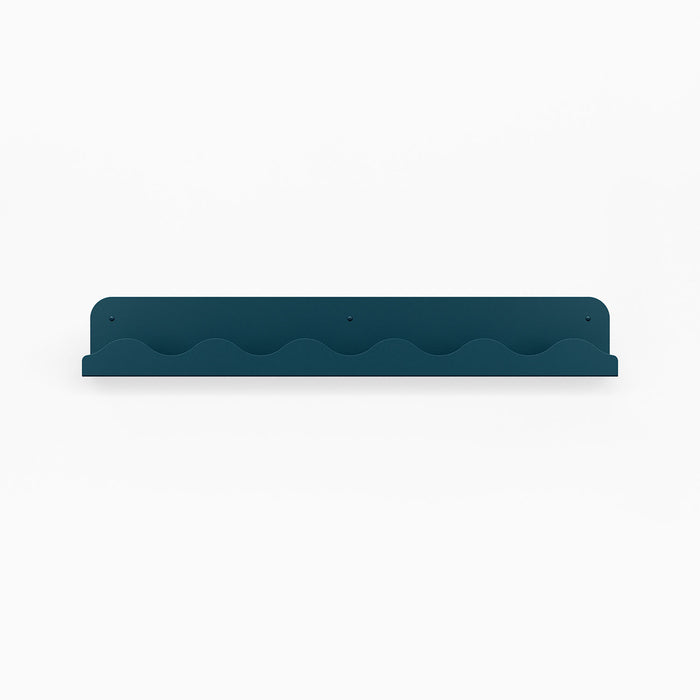 Wave Picture Ledge in deep winkler blue steel with wave-patterned edge for minimalist wall shelf and display organization