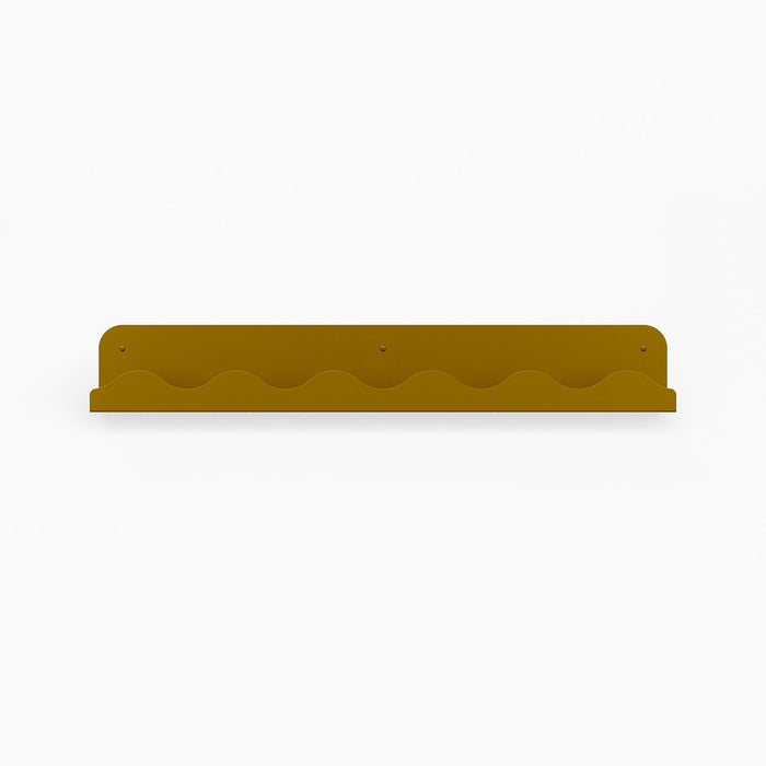 Wave Picture Ledge in warm mustard steel with wave-inspired edge for functional floating shelf and wall display organization