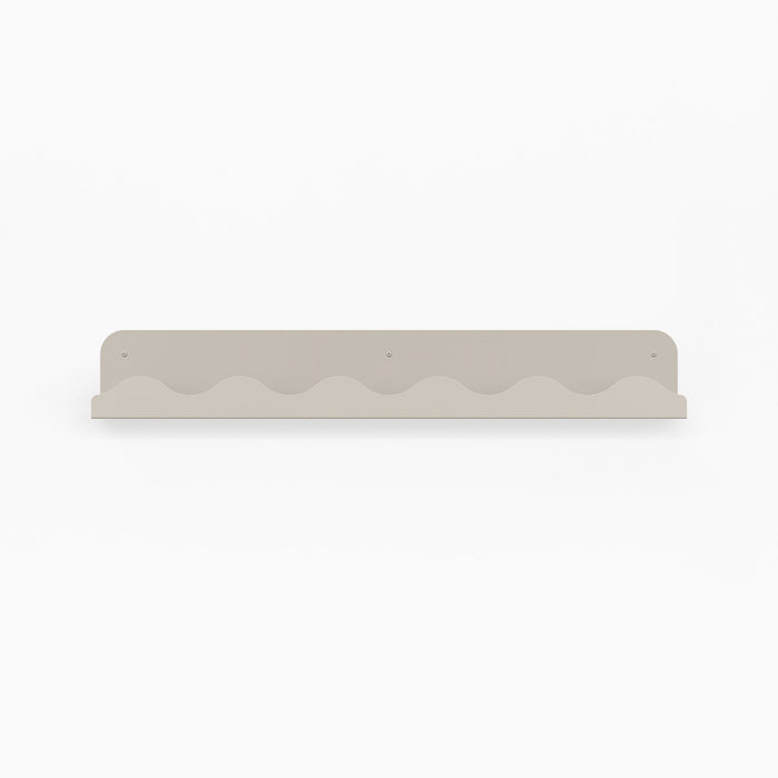Wave Picture Ledge in neutral steel with wave-inspired edge for minimalist floating shelf and wall display organization
