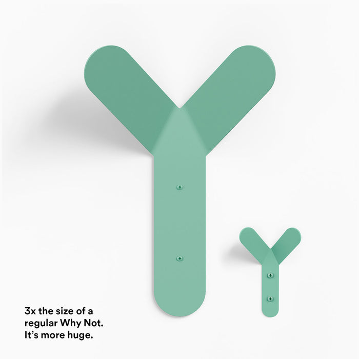 Why Not More Huge Wall Hook in muted green steel shown in size comparison highlighting its oversized design