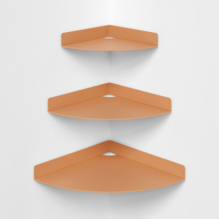 Wink Round Corner Shelf in matte warm clay steel with minimalist design for efficient wall corner organization and display