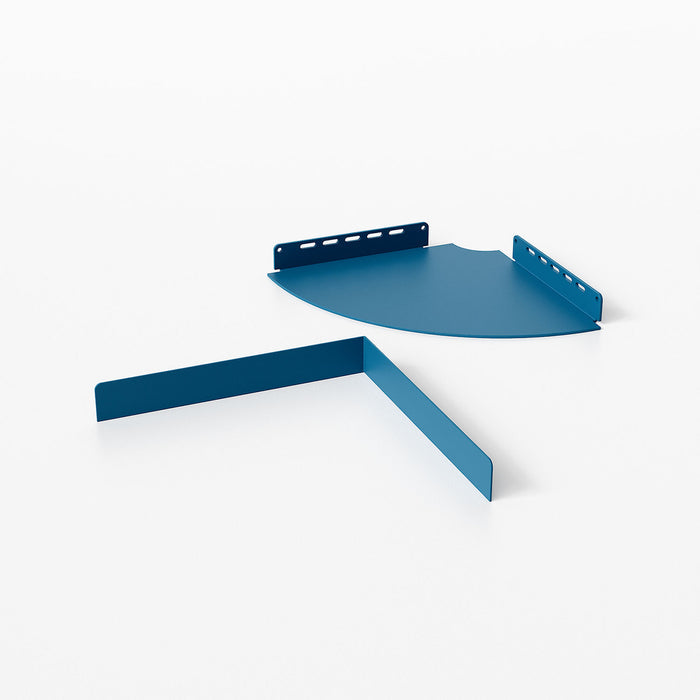 Wink Round Corner Shelf in matte steel with rich blue finish and curved design for versatile wall corner display and organization