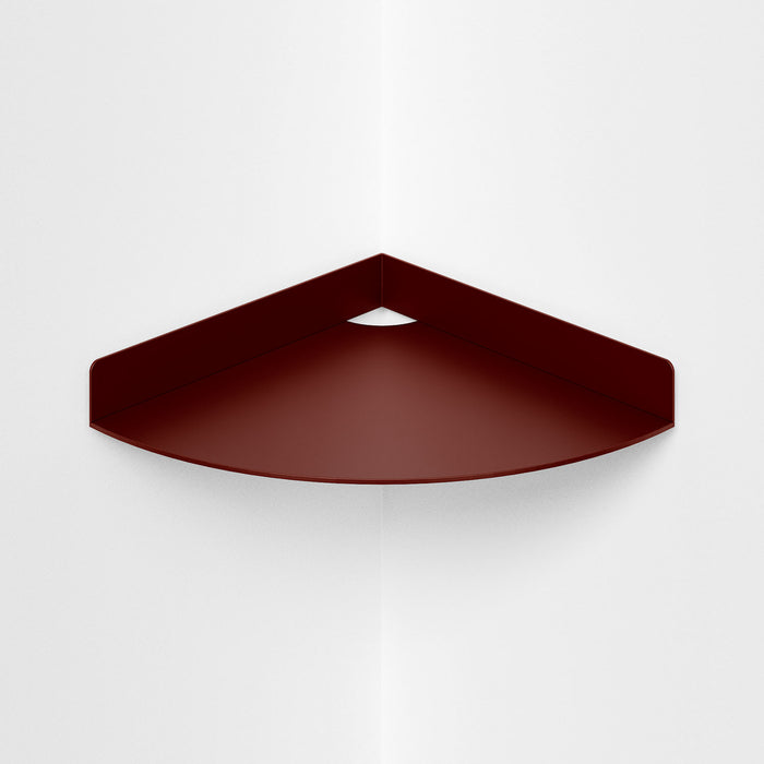 Wink Round Corner Shelf in matte warm clay steel with smooth curved edge for practical and stylish wall corner storage