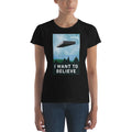 Women's Believe T-shirt in black with graphic of floating shelf and "I WANT TO BELIEVE" text by Shelfology