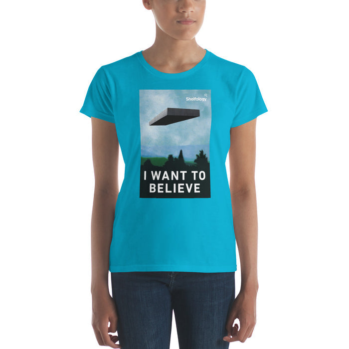 Women's Believe T-shirt in bright blue with floating shelf graphic and "I WANT TO BELIEVE" text by Shelfology
